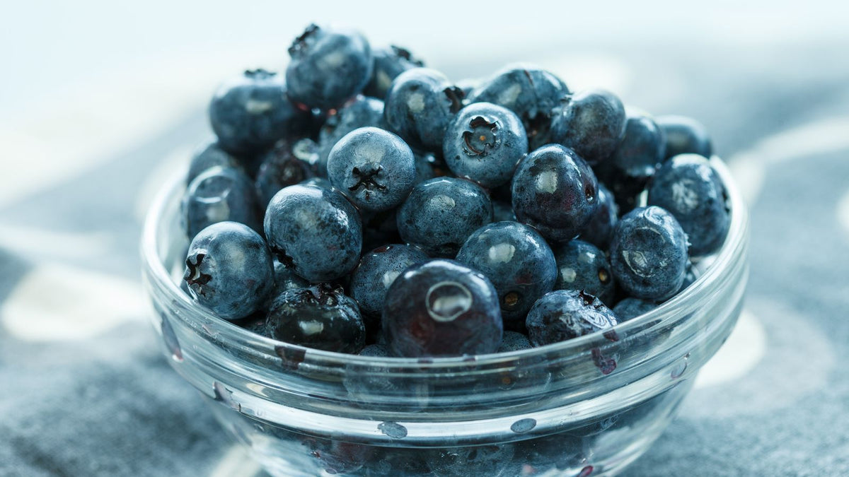 Fresh blueberries in a glass bowl