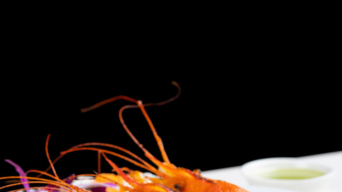 Grilled prawns on a plate, relevant to whether dogs can eat prawns