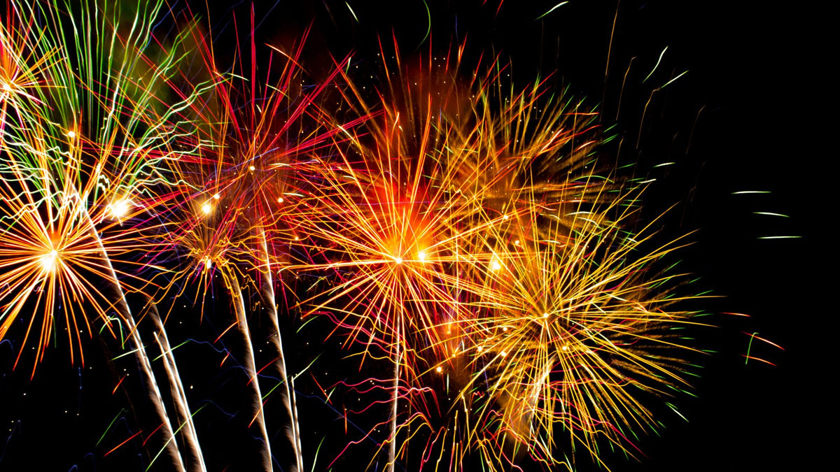 Fireworks lighting up the night sky, relevant to preparing your dog for Bonfire Night