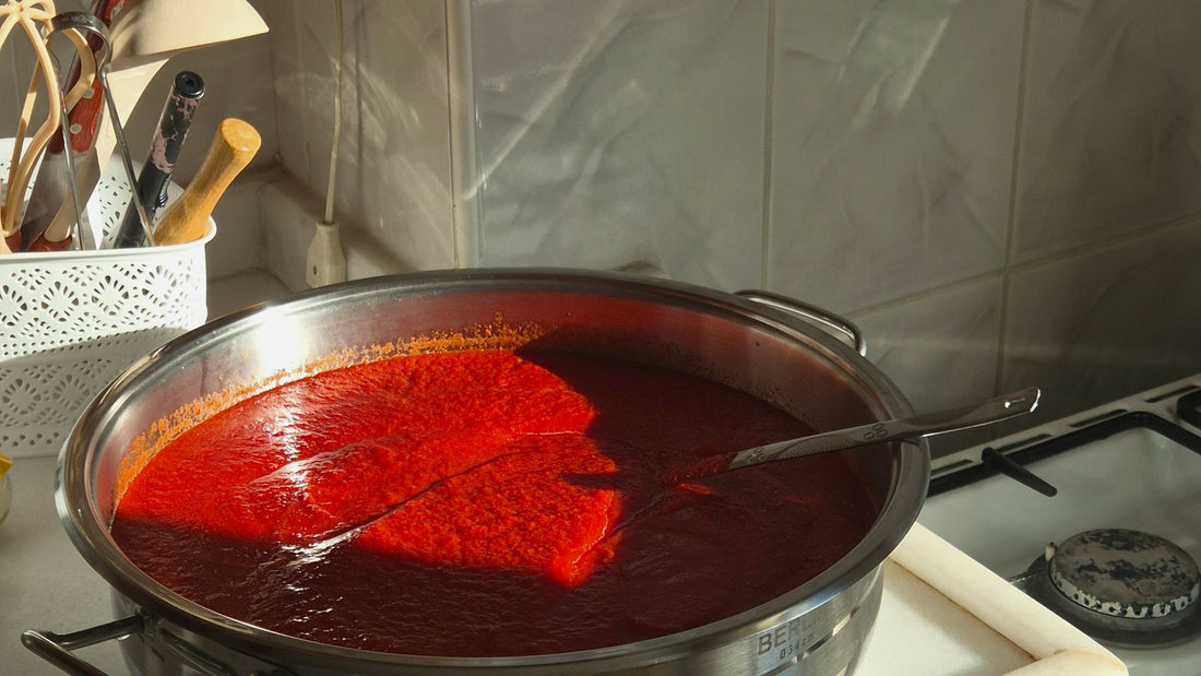 Tomato sauce simmering in a pot, relevant to whether dogs can eat tomato sauce