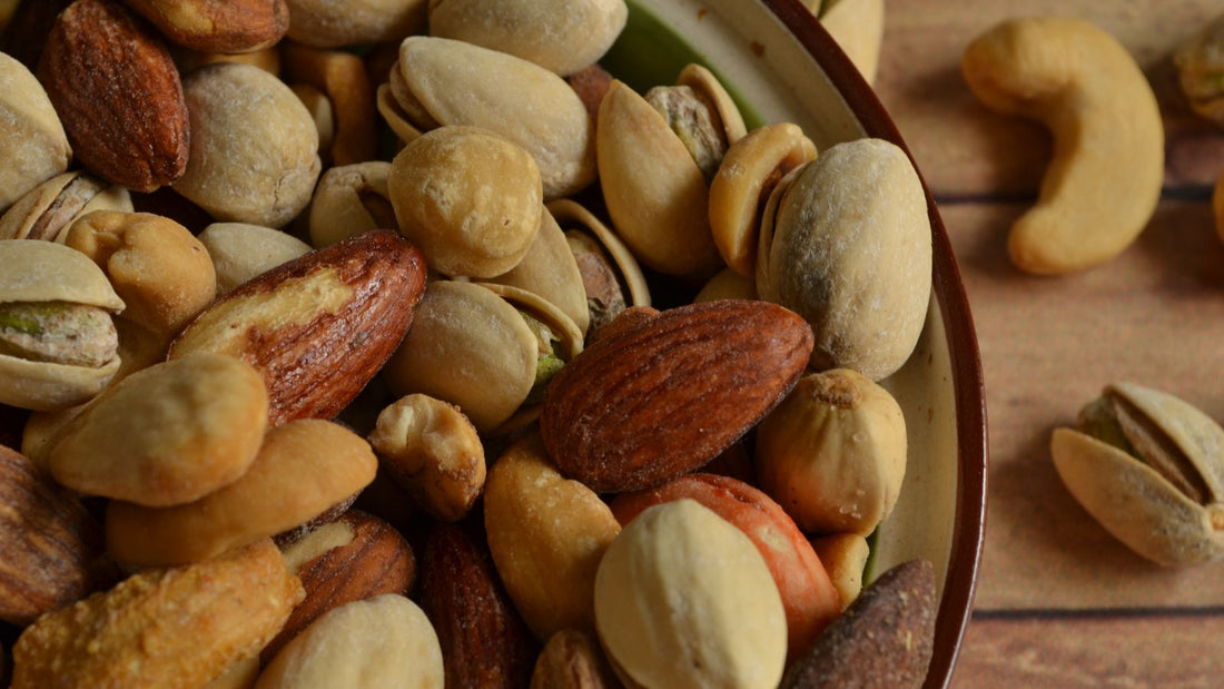 Assorted almonds, cashews and pistachios in a rustic bowl