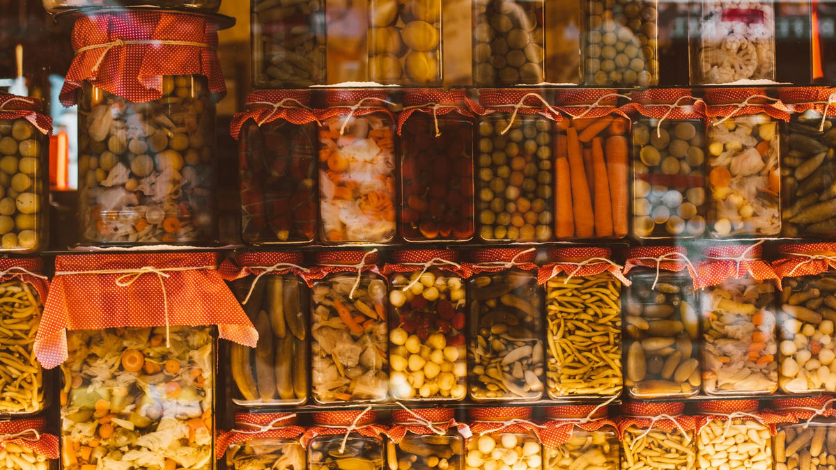 Jars of pickled vegetables, relevant to whether dogs can eat pickles