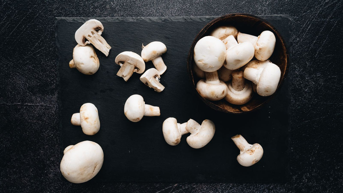 Fresh button mushrooms in a bowl